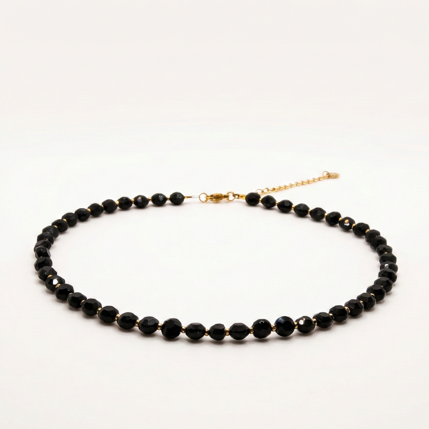 Krótki naszyjnik z kamieni: złoty hematyt, onyks